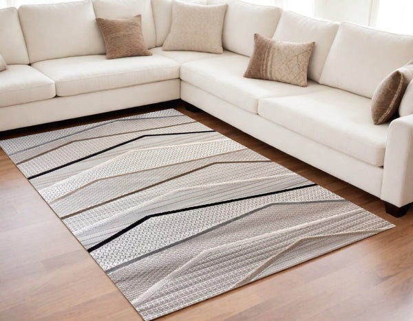 HomeRoots 5' Abstract Area Rug in Gray, Brown & Beige - Durable, Stain-Resistant Design for Modern Spaces 5' X 8' 558404