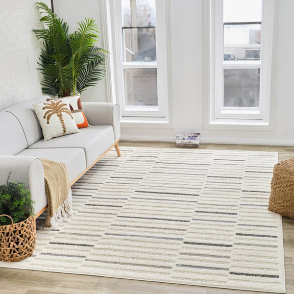 HomeRoots 5' Gray and Cream Abstract Distressed Area Rug - Modern Elegance for High-Traffic Spaces and Homes 8' X 11' 558467
