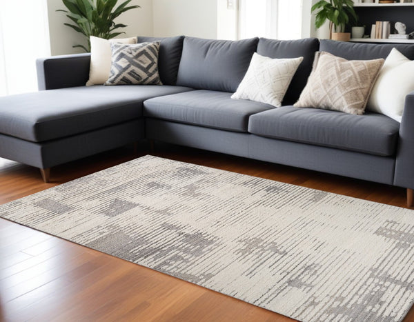 HomeRoots 5' Gray and Cream Abstract Distressed Area Rug - Stylish, Durable Design for Busy Homes & Modern Decor 7' X 10' 558471