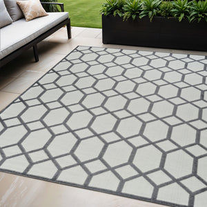 Homeroots 5' X 7' Beige And Gray Geometric Distressed Indoor Outdoor Area Rug  Polypropylene 558724