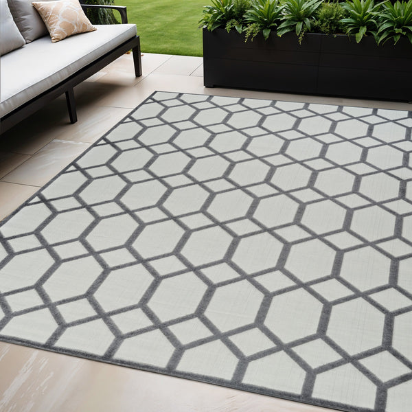 Homeroots 5' X 7' Beige And Gray Geometric Distressed Indoor Outdoor Area Rug  Polypropylene 558724