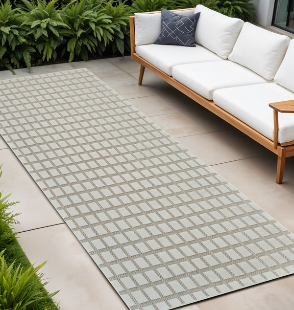 Homeroots 10' Cream And Beige Geometric Distressed Indoor Outdoor Runner Rug  Polypropylene 558792