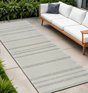 Homeroots 10' Cream And Beige Striped Distressed Indoor Outdoor Runner Rug  Polypropylene 558799