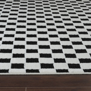 Homeroots 10' Black And White Geometric Distressed Indoor Outdoor Runner Rug  Polypropylene 558806
