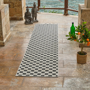 Homeroots 10' Black And White Geometric Distressed Indoor Outdoor Runner Rug  Polypropylene 558806