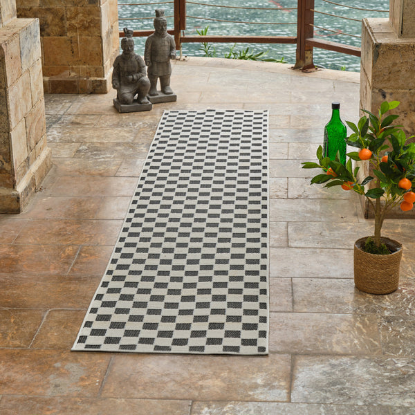 Homeroots 10' Black And White Geometric Distressed Indoor Outdoor Runner Rug  Polypropylene 558806