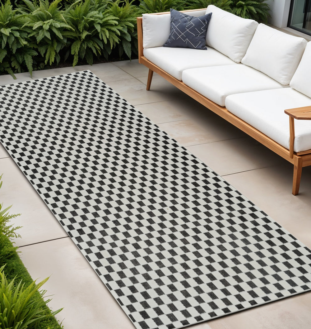 Homeroots 10' Black And White Geometric Distressed Indoor Outdoor Runner Rug  Polypropylene 558806