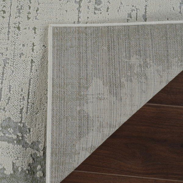 HomeRoots 4' Beige and Green Abstract Distressed Area Rug - Stylish, Stain-Resistant Design for Home Spaces 4' X 6' 558848