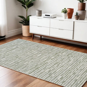 HomeRoots 4' Abstract Distressed Area Rug in Beige and Green - Versatile, Soft, Durable for Modern Homes 4' X 6' 558896