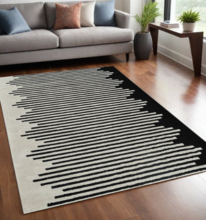 Homeroots 5' X 8' Cream And Black Abstract Worn Faded Area Rug  Polypropylene 559013