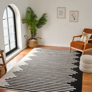 HomeRoots 4' Cream and Black Abstract Distressed Area Rug – Modern Style, Plush Comfort, Durable for Homes 7' X 10' 559014