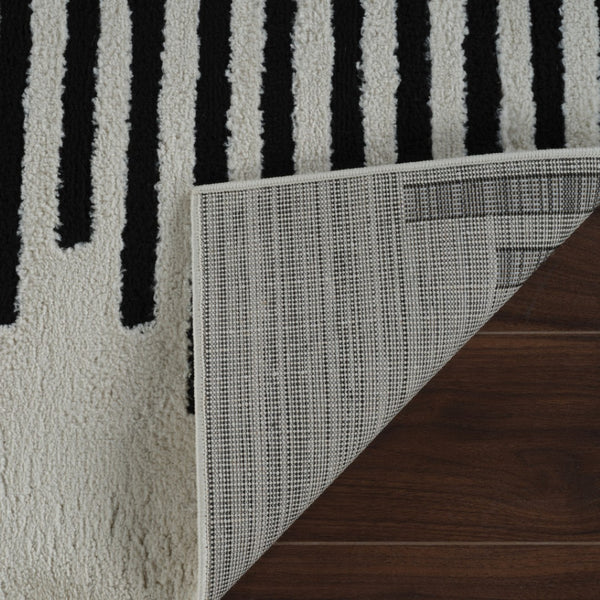 HomeRoots 4' Cream and Black Abstract Distressed Area Rug – Modern Style, Plush Comfort, Durable for Homes 7' X 10' 559014