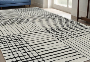 Homeroots 5' X 8' Cream And Black Abstract Distressed Area Rug  Polypropylene 559021