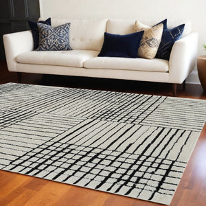 Homeroots 7' X 10' Cream And Black Abstract Distressed Area Rug  Polypropylene 559022