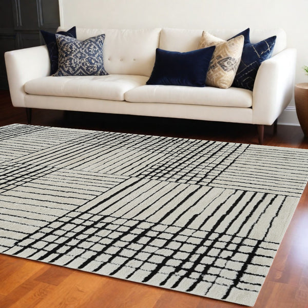 Homeroots 8' X 11' Cream And Black Abstract Distressed Area Rug  Polypropylene 559023