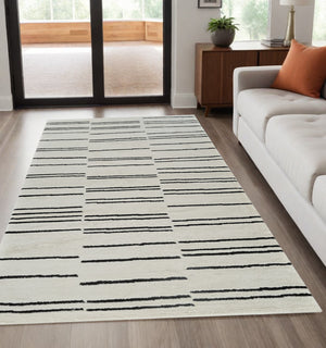Homeroots 5' X 8' Cream And Black Abstract Worn Faded Area Rug  Polypropylene 559029
