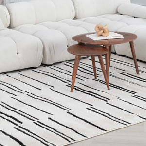 Homeroots 5' X 8' Cream And Black Abstract Worn Faded Area Rug  Polypropylene 559029