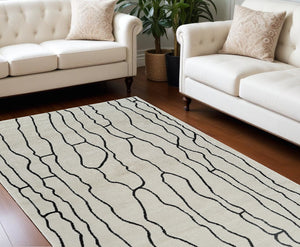 Homeroots 8' X 11' Cream And Black Abstract Distressed Area Rug  Polypropylene 559035