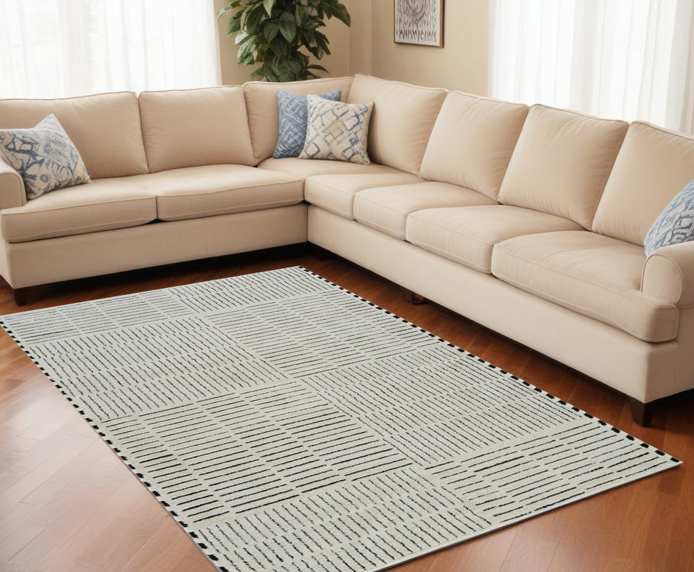 Homeroots 5' X 8' Cream And Black Abstract Distressed Area Rug  Polypropylene 559037