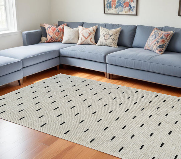 Homeroots 8' X 11' Cream And Black Abstract Distressed Area Rug  Polypropylene 559047