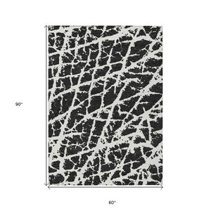 HomeRoots 5' Beige and Ivory Abstract Area Rug - Washable, Non-Skid, Stylish for Indoor and Outdoor Spaces 5' X 8' 559239