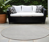 Homeroots 8' Round Gray And Ivory Round Striped Washable Non Skid Indoor Outdoor Area Rug Pewter Polyester 561100