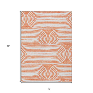 Homeroots 3' X 5' Orange And Ivory Abstract Washable Non Skid Indoor Outdoor Area Rug Salmon Polyester 561861