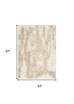 Homeroots 5' X 7' Beige And Ivory Abstract Shag Area Rug  Polyester 564078