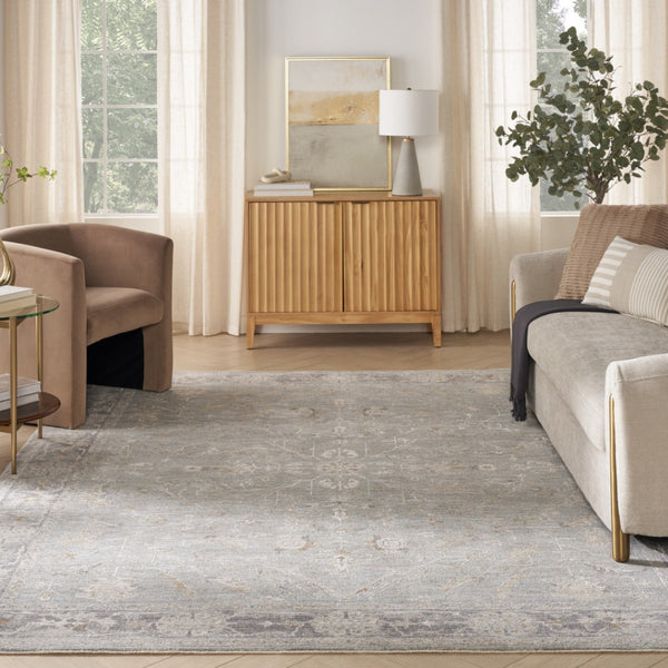 HomeRoots 8' Blue Floral Power Loom Area Rug - Elegant Distressed Design with Fringed Edges for Timeless Charm 8' X 10' 564167