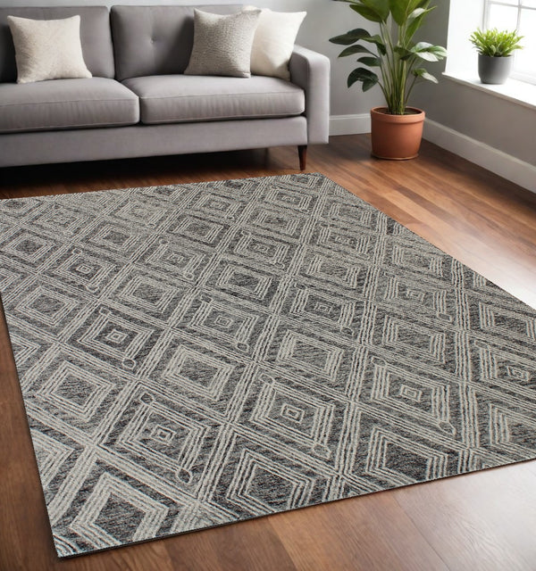 Homeroots 5' X 8' Black And Ivory Wool Abstract Geometric Hand Tufted Non Skid Area Rug  Wool 564800