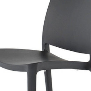 HomeRoots Set of Four Stylish Dark Gray Heavy-Duty Stacking Chairs for Outdoor Dining & Versatile Use 565210