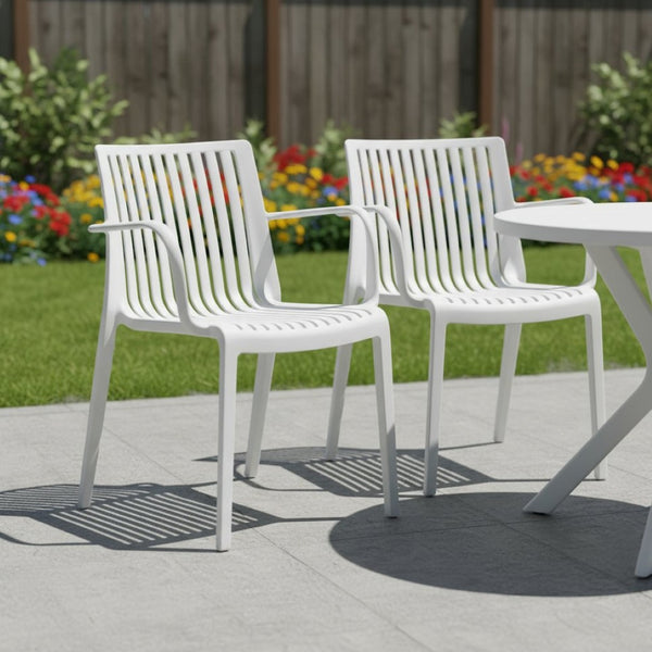 HomeRoots Set of Two White Heavy Duty Plastic Outdoor Arm Chairs - Durable, Stackable, and Versatile Seating 565275