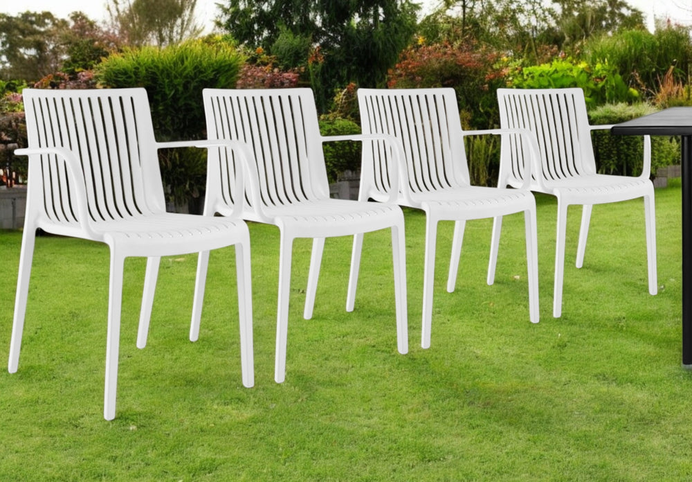 Homeroots Set Of Four 22" White Heavy Duty Plastic Stacking Arm Chairs For Stylish Outdoor Relaxation  Polypropylene 565275