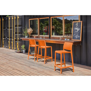 Homeroots Set Of Four 26" Orange Heavy Duty Plastic Low Back Bar Chairs For Stylish Outdoor Gatherings   565371