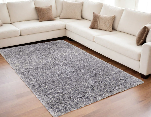 HomeRoots 4' Black Shag Area Rug - Luxurious Hand-Tufted Design for Modern Homes, Stain-Resistant & Soft Feel 5' X 8' 565486