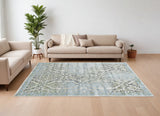 Homeroots 7' X 10' Blue Gray And Green Floral Power Loom Worn Faded Area Rug Blue Polypropylene 565703