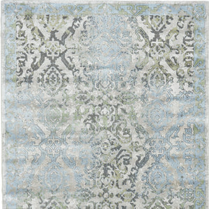Homeroots 10' X 13' Blue Gray And Green Floral Power Loom Worn Faded Area Rug Blue Polypropylene 565705