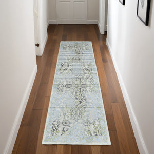 Homeroots 8' Blue Gray And Green Floral Power Loom Worn Faded Runner Rug Blue Polypropylene 565706