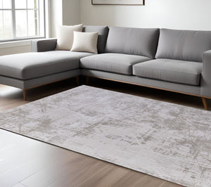 HomeRoots 5' Taupe and Silver Abstract Distressed Area Rug – Glamorous, Durable Design for Modern Interiors 8' X 11' 565741