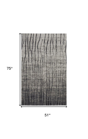HomeRoots 4' Gray and Black Abstract Area Rug - Contemporary Power Loom Design for High-Traffic Spaces 4' X 6' 565959