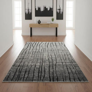 HomeRoots 4' Gray and Black Abstract Area Rug - Contemporary Power Loom Design for High-Traffic Spaces 4' X 6' 565959