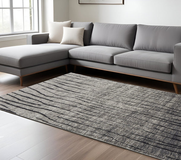 HomeRoots 4' Gray and Black Abstract Area Rug - Contemporary Power Loom Design for High-Traffic Spaces 5' X 8' 565960