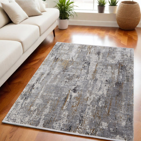 HomeRoots 3' Modern Gray Ivory Gold Abstract Power Loomed Area Rug with Fringed Edges for Stylish Spaces 5' X 8' 565993
