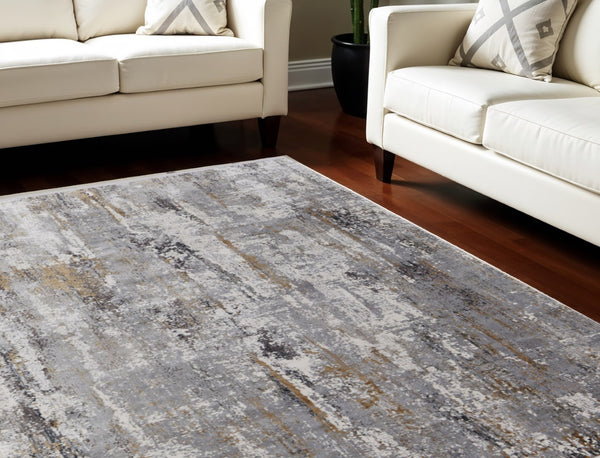 HomeRoots 3' Modern Gray Ivory Gold Abstract Power Loomed Area Rug with Fringed Edges for Stylish Spaces 10' X 13' 565996