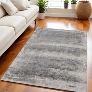 Homeroots 5' X 8' Gray Abstract Power Loom Area Rug With Fringe Taupe Viscose 566003