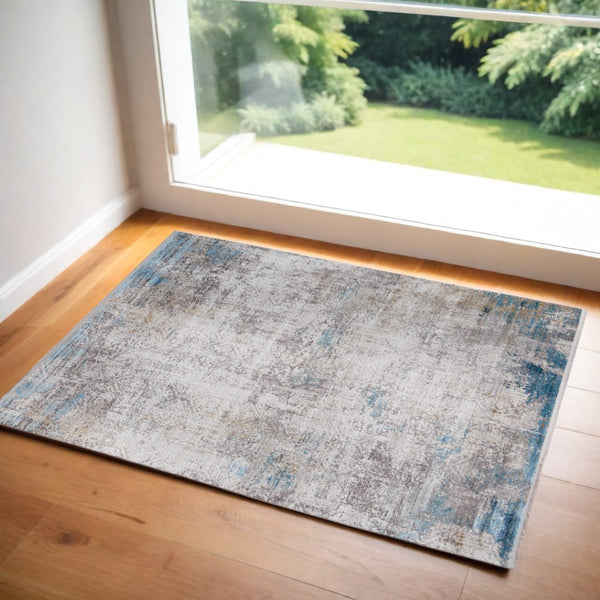 HomeRoots 3' Modern Abstract Ivory Gray and Blue Power Loom Area Rug with Tasseled Edges for Style & Comfort 3' X 5' 566012