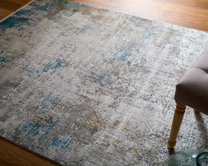HomeRoots 3' Modern Abstract Ivory Gray and Blue Power Loom Area Rug with Tasseled Edges for Style & Comfort 7' X 10' 566014