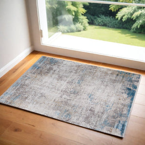 HomeRoots 3' Modern Abstract Ivory Gray and Blue Power Loom Area Rug with Tasseled Edges for Style & Comfort 2' X 3' 566021