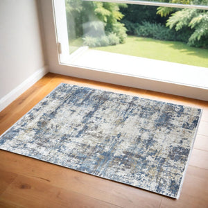 HomeRoots 3' Elevate Your Space with a Stylish Ivory Tan and Blue Abstract Power Loom Area Rug with Fringe 3' X 5' 566032