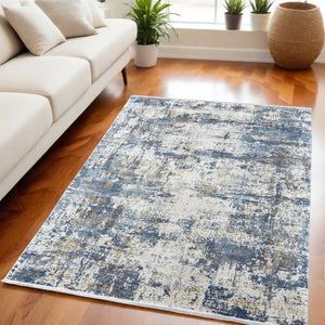 HomeRoots 3' Elevate Your Space with a Stylish Ivory Tan and Blue Abstract Power Loom Area Rug with Fringe 5' X 8' 566033